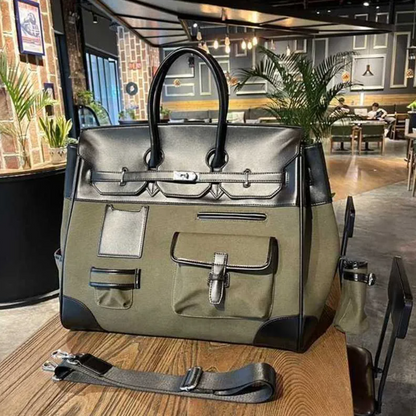 Large green and black handbag on a wooden table with a restaurant interior in the background