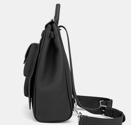 Black backpack with a strap on a light gray background
