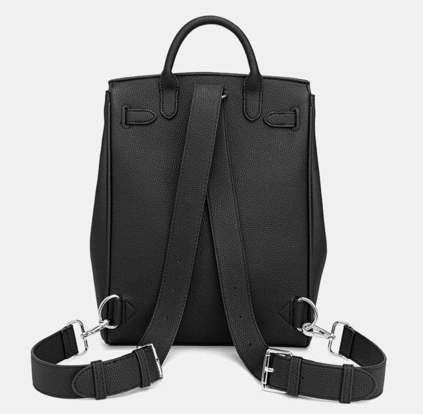Black leather backpack with adjustable straps on a light gray background