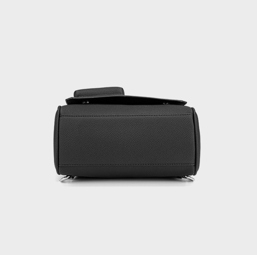 Black cylindrical bag on a light gray background